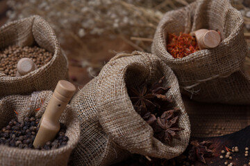 Spicy condiment, herbal aroma dry food for Asian cookin on wood  cutter with dry seed and colorful powder for kitchen ingredient