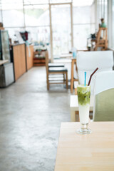 Dark brownie cake, the chocolate dessert with almond topping and chocolate decorating on white ceramic plate.