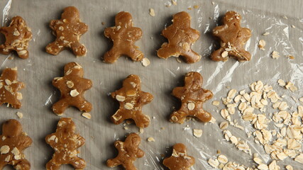 Ginger bread cookies homemade cooking for Christmas traditional dessert. Kids and family love to prepare to make dough and bake them. Then paint them with sugar paste to decor in many colors.