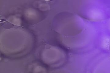 Close up Macro colorful oil and water circles iluminated abstract