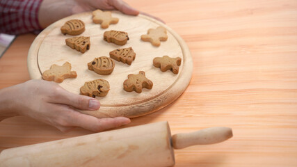 Ginger bread cookies homemade cooking for Christmas traditional dessert. Kids and family love to prepare to make dough and bake them. Then paint them with sugar paste to decor in many colors.
