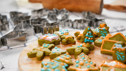 Green ginger bread cookies homemade cooking for Christmas traditional dessert. Kids and family love to prepare green tea cookies. Celebreation cookes for Chirstmas.