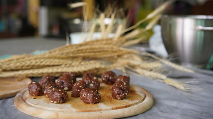 Oatmeal and banana chocolate cookies while preparation from dough to baking. Dessert recipe of pastry. Sweet homemade bake