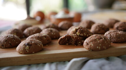 Oatmeal and banana chocolate cookies while preparation from dough to baking. Dessert recipe of pastry. Sweet homemade bake