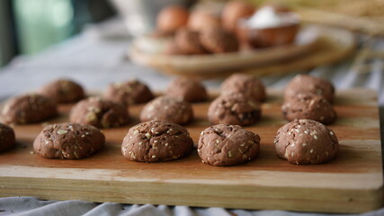 Oatmeal and banana chocolate cookies while preparation from dough to baking. Dessert recipe of pastry. Sweet homemade bake