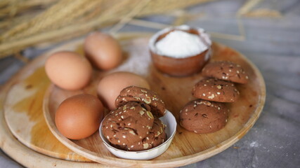 Oatmeal and banana chocolate cookies while preparation from dough to baking. Dessert recipe of pastry. Sweet homemade bake