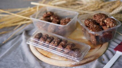 Oatmeal and banana chocolate cookies while preparation from dough to baking. Dessert recipe of pastry. Sweet homemade bake