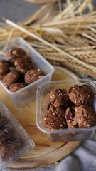 Oatmeal and banana chocolate cookies while preparation from dough to baking. Dessert recipe of pastry. Sweet homemade bake