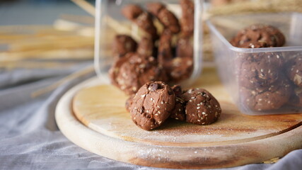 Oatmeal and banana chocolate cookies while preparation from dough to baking. Dessert recipe of pastry. Sweet homemade bake
