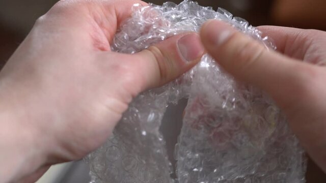 Clicking and bursting of bubble wrap due to nerves and to calm down