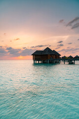 Maldives paradise scenic landscape. Seascape with water bungalows, turquoise sea and lagoon waters, tropical nature. Exotic tropical island beach background. Romantic holiday & honeymoon destination.