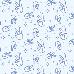 seamless pattern with hands two thumbs up sign of victory.