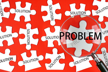 Problem and Solution concepts. Magnifying glass focusing on PROBLEM wording while there is other SOLUTIONS around
