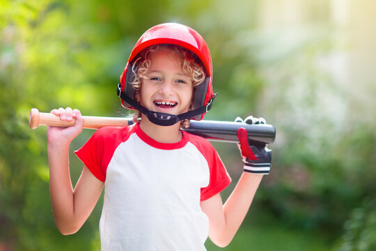 Kids Play Baseball. Child With Bat And Ball.