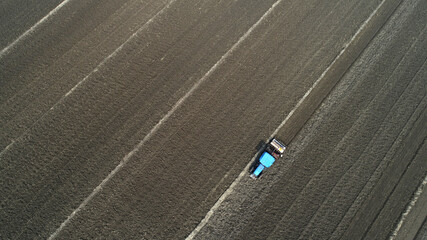 Farmers drive tractors to level up land, North China