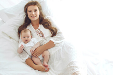 Portrait of a beautiful mother, with her nursing baby. High quality photo.
