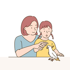 Mother and daughter are looking at the parrot. hand drawn style vector design illustrations. 