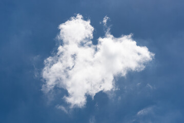 Beautiful cloudscape of nature single white cloud on blue sky background in daytime