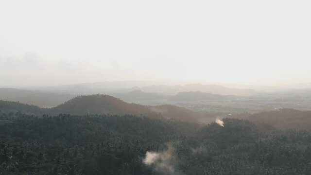Camalig Albay, Philippines, Misty morning with steam coming out of the fortress. Cinematic aerial shot with copy space