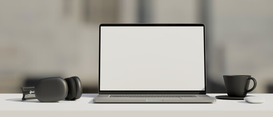 Black and white workspace with mock-up laptop, headphones and cup, 3D rendering