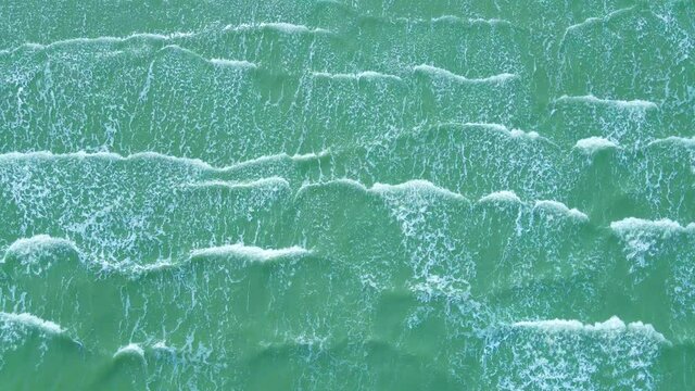 Top View of the waves, Foaming and Splashing in the Ocean