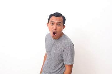 Wow and surprised face of Asian man in grey t-shirt. Isolated on white background