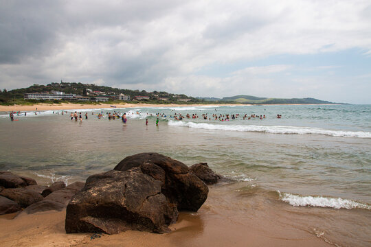 Holiday Makers Swimming in the Sea at Scottburgh, South Africa