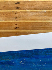 Wooden planks painted in blue and white colors