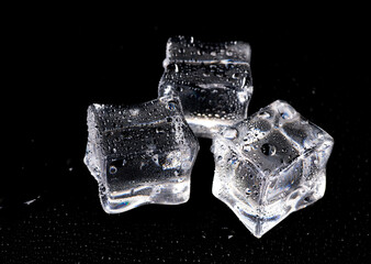 Ice cubes on black background