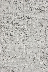 Wall grunge texture. Grey uneven wall surface. Whitewashed wall
