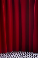 Twin peaks scene with red velvet curtain and black and white tile on floor, vertical. Theatre blank...