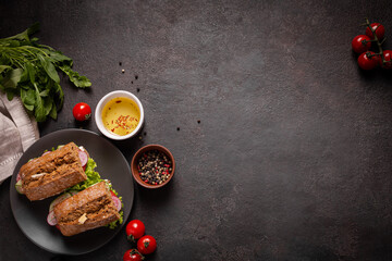 Sandwiches with vegetables for lunch on a black background