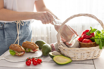 Woman preparing a picnic basket