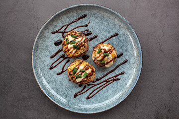 Stuffed mushroom caps with cream cheese, breadcrumbs and parmesan