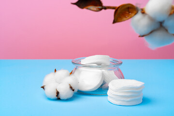 Female medical tampons on pink and blue background