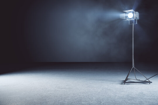 Minimalistic concrete photo studio background with lamps and mockup place. 3D Rendering.