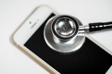 Fototapeta na wymiar Stethoscope with smart phone. on white, background to solution problem for smart phone.white background.