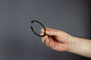 A man demonstrates Locking Ring against a gray background. New M