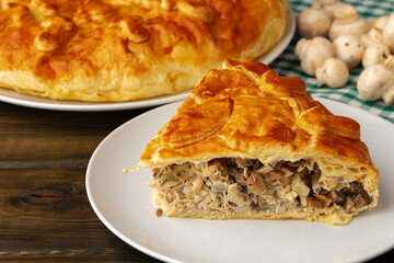 Fresh meat pie on served on wooden table