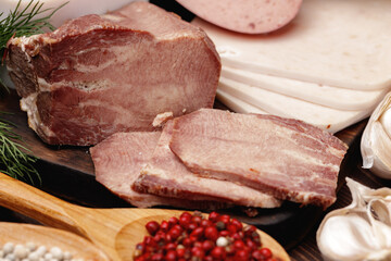 Variety of meat and sausage products on table