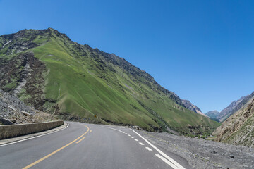 Highways with mountains and grasslands in Xinjiang, China in summer