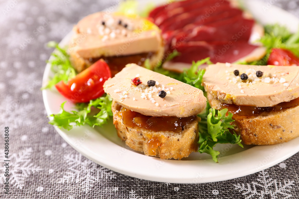 Sticker canape with foie gras and salad