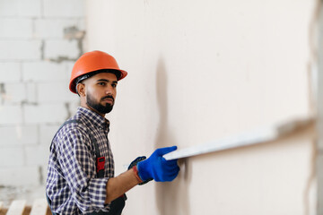 Decorative plaster applied on the surface by a steel trowel. White cement based decorative top coat plaster resistant on outside whether conditions. Gypsum Workers .