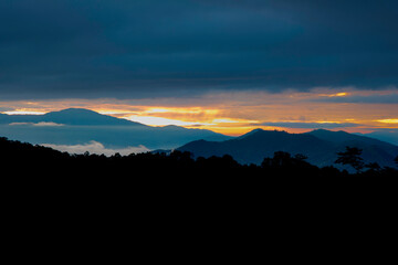 Fototapeta premium Beautiful sunshine at misty morning mountains at north thailand