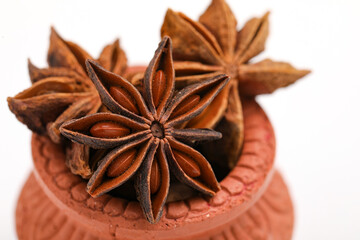 Star anise spice fruits and seeds isolated on white background closeup.