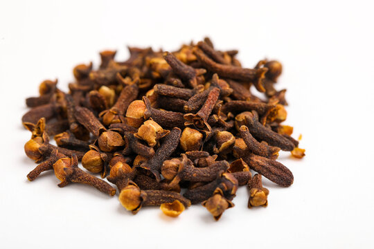 Spice cloves on white background.