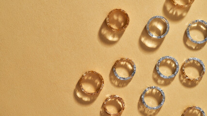 Collection of clear acrylic rings lying falt