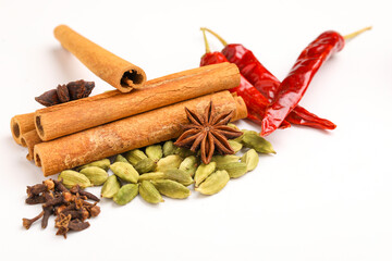 Indian spices and herbs on white background.