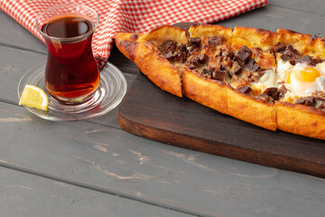 Close up of Turkish Pide bread on wooden table