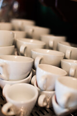 Fototapeta na wymiar Stack of empty white coffee cups
